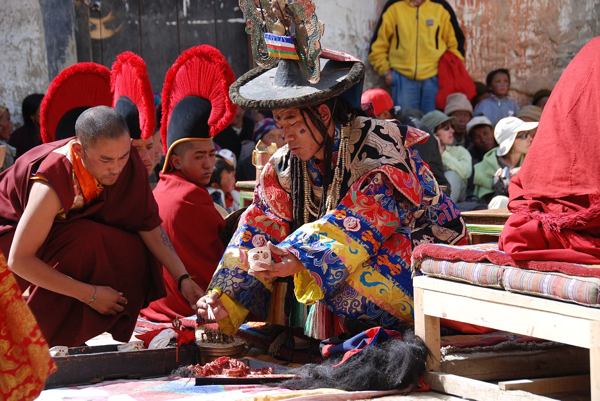 Mustang Lo Manthang Tiji Festival Day 3 06-1 Dorje Jono Sprinkles Salt On The Effigy Of His Demon Father